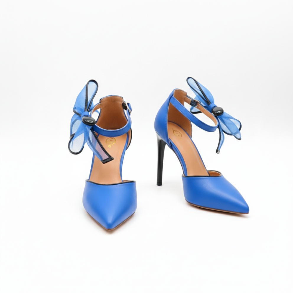Pair of blue high-heeled shoes with bow details on a white background