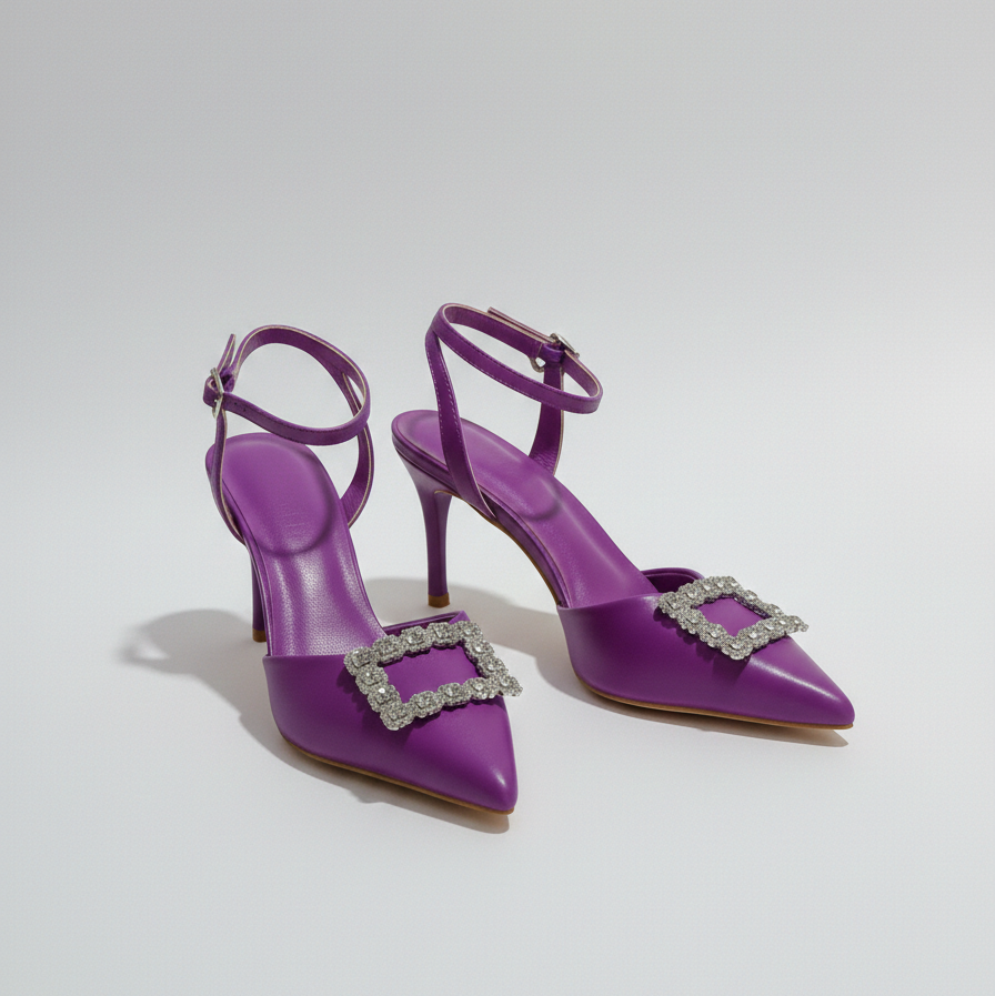 Purple high-heeled shoes with decorative buckles on a light gray background