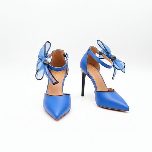 Pair of blue high-heeled shoes with bow details on a white background